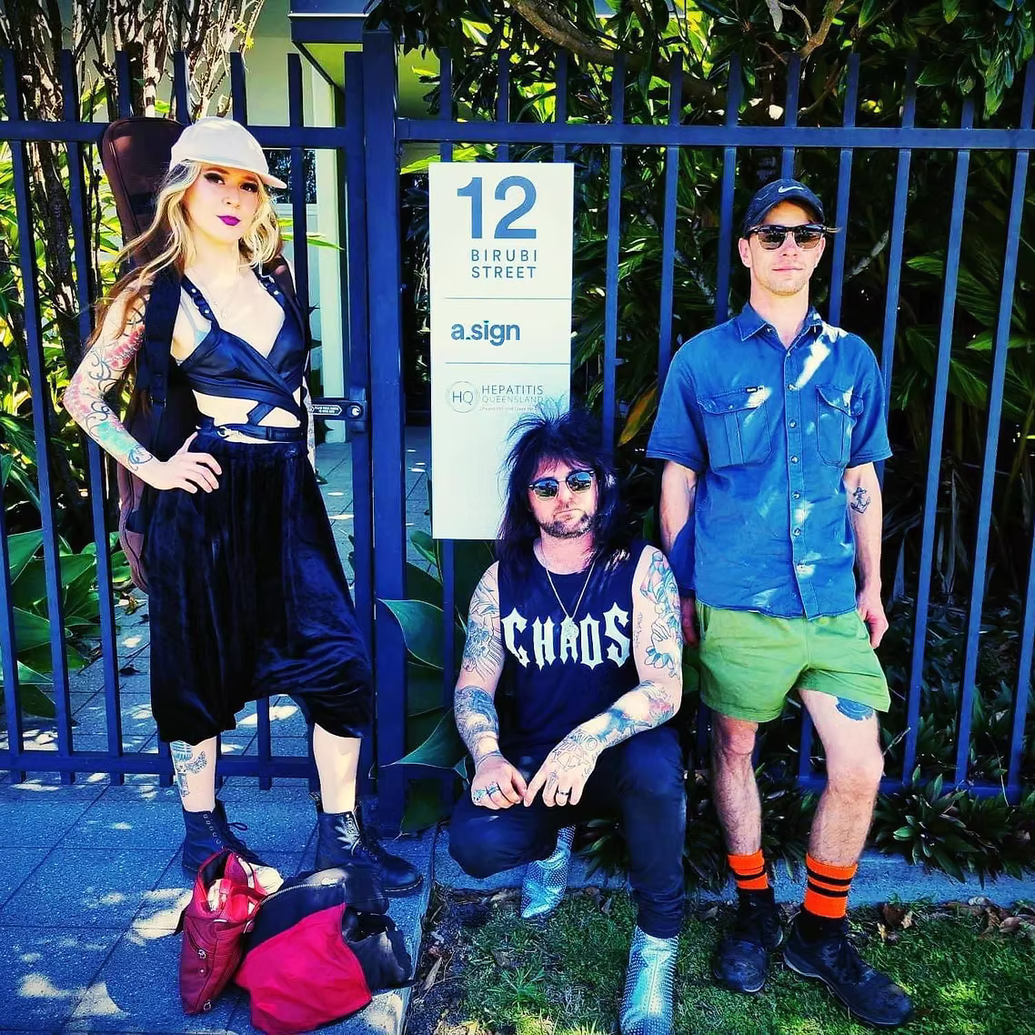 Aether Brisbane band standing outside of the 'hepatitis clinic'